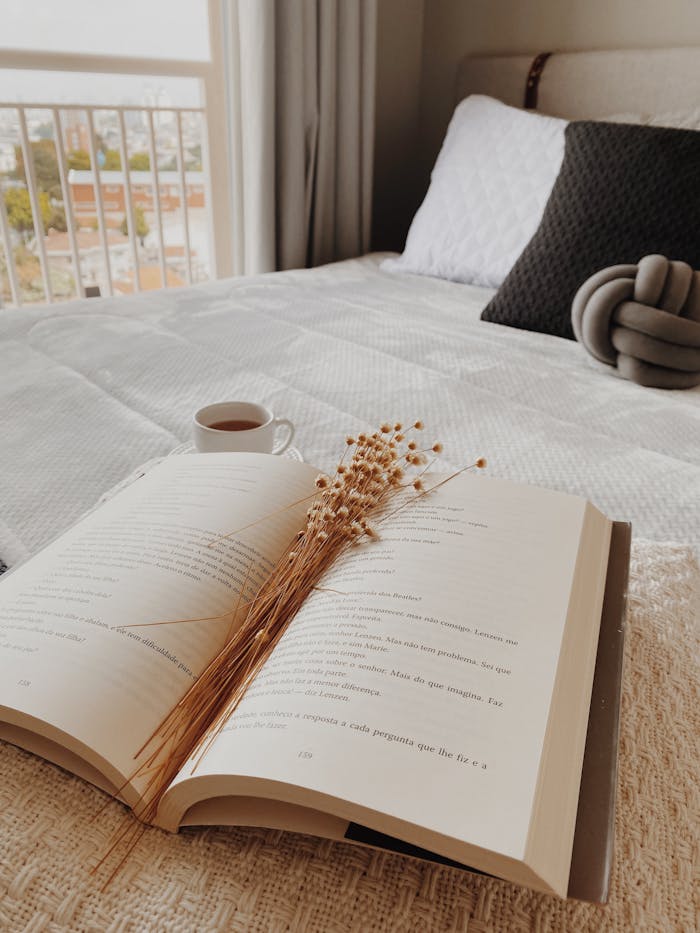 Mastering the First Impression: Your intriguing post title goes here Peaceful São Paulo bedroom featuring an open book and cup of tea for a relaxing moment.